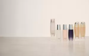 Group of Sensai Step 1 lotions next to each other on top of light gray glossy surface